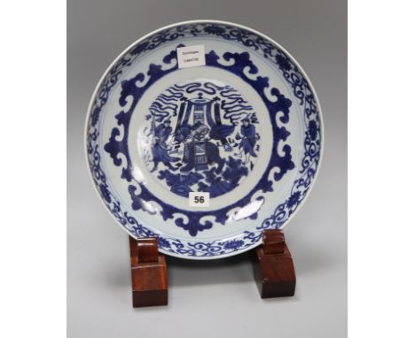 A Chinese blue and white dish, in Kangxi style, wood stand diameter 34cm