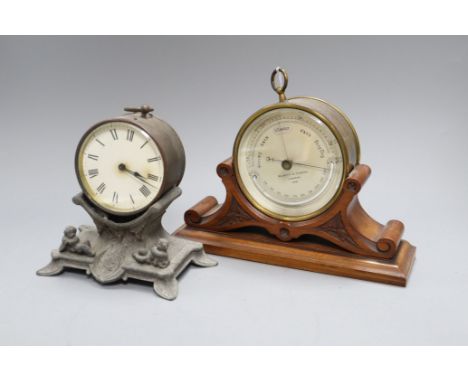 A Victorian Negretti and Zambra lacquered brass desk barometer thermometer on walnut stand and a timepiece on a spelter stand