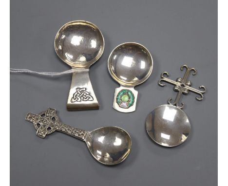 Four assorted Arts &amp; Crafts style silver caddy spoons including enamelled, two Scottish including Elizabeth Henry Kirkwoo