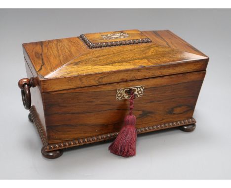 An early 19th century mother of pearl-inlaid rosewood sarcophagus tea caddy