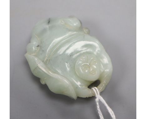 A Chinese pale celadon and grey jade figure of a man and lotus