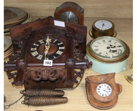 A cuckoo clock and four others