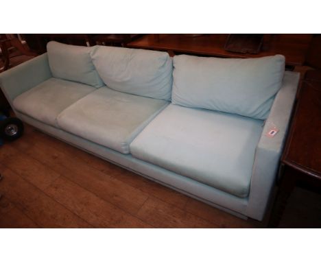 A large pale blue linen upholstered three seater settee L.240cm approx.