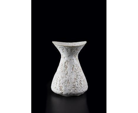 Lucie Rie (1902-1995) Vase stoneware, with white pitted and textured glaze, flaring rim impressed potter's seal 15.5cm high, 