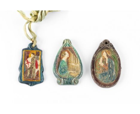 Mary Watts (1849-1938) for Compton Pottery  Three pendants modelled in low relief depicting a lady playing an organ, a lady s