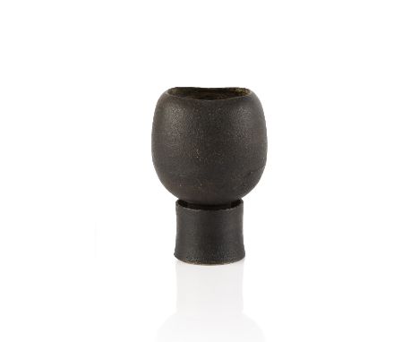 Hans Coper (1920-1981) Footed pot black glaze, the interior with cylindrical stem holder impressed potter's seal 10.7cm high,