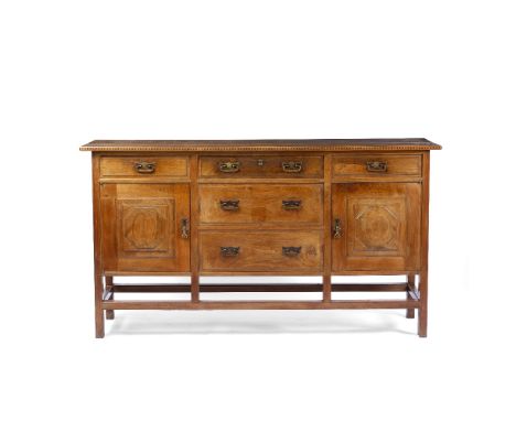 Peter Waals (1870-1937) from a design by Ernest Gimson (1864-1919)Sideboard, first designed 1915 walnut, with four short draw