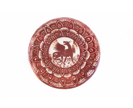 William De Morgan (1839-1917) Charger decorated in ruby lustre depicting a gryphon within a stylised border 30cm diameter. Pr