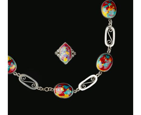 Arts and Crafts Enamel panel ring heightened in shades of red, yellow, green and blue with foliate shoulders stamped 'Sterlin