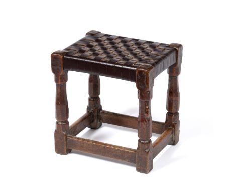 Robert Thompson of Kilburn (1876-1955) Early Mouseman stool, circa 1930 oak, with woven leather top  carved mouse signature  