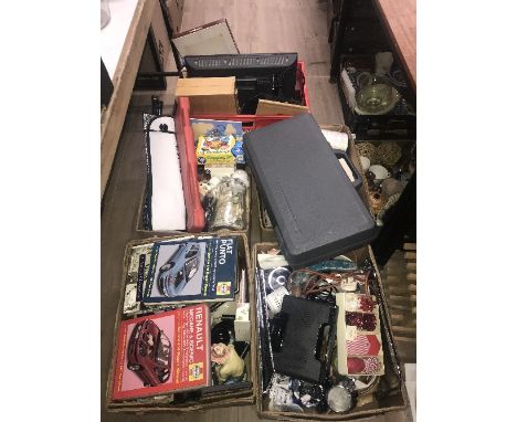 4 BOXES OF MISCELLANEOUS INCLUDES AUTO MANUALS  HAND TOOLS CHINA AND GLASS AND BOXED GOLF TRAINER