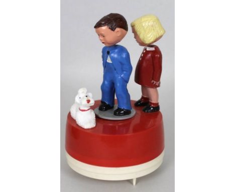 A collection of assorted vintage toys to include clockwork kissing dolls, Magneto, boxed with key, 1950's Hohner Great Little