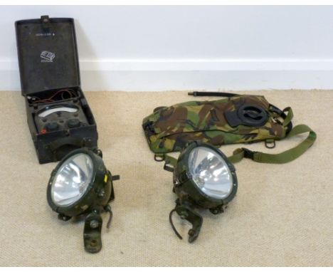 Two Army Jeep spot lights with handle, a camel back water pack and a Nato test multi range universal meter, marked Nato Stock