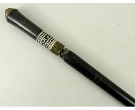 An ebonised sword stick with bone and brass collars, and brass top, 91cm.