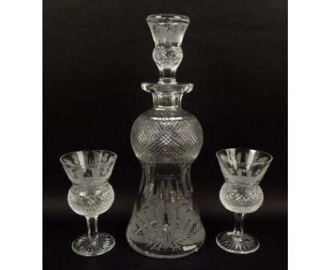 A set of Edinburgh Crystal, thistle shaped glassware, engraved with thistles and leaves, comprising a decanter, 31cm, and six