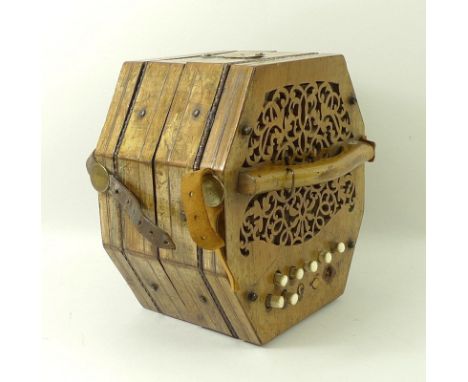 A German made boxwood musical accordion, with fretwork pierced ends and brass dolphin catches. 