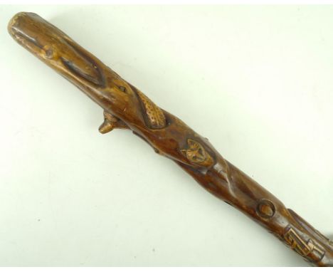 An Indian Railways carved walking stick, depicting animal heads and a guard with peaked cap, 84cm.
Provenance: The stick belo