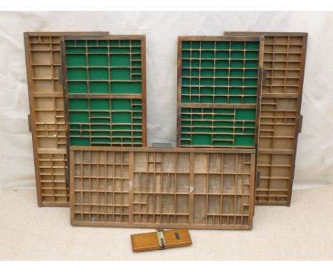 Five printer's trays, 82 by 37 by 4cm deep, and a tie press. (5)
Provenance: From the collection of Bat related items of Dr &