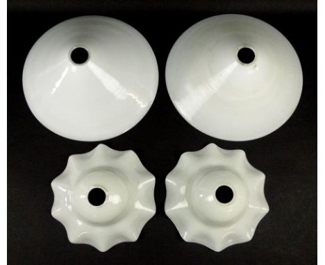 A pair of Chinese hat style white glass lamp shades, 26cm diameter, and a pair of white glass lamp shades with wavy rims one 