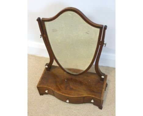 A 19th century mahogany and cross banded toilet mirror with lyre shaped supports and shield shaped plate, set with turned ivo