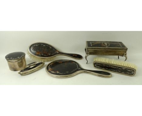 A collection of silver and tortoiseshell dressing table items, comprising a rectangular trinket or jewellery box, the lid wit