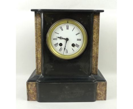 A marble and black slate mantel clock with eight day movement, white face with Roman numerals, chiming, by Thieble, 25 by 14 