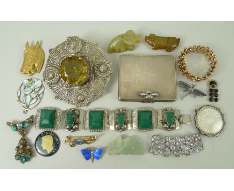 A collection of costume jewellery comprising a powder compact, Celtic bangle, cufflinks, brooches, and bracelets. 