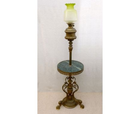 A Victorian brass 'Messenger's Patent' adjustable paraffin standard lamp with green marble circular tray table and raised on 