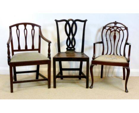 A 19th century oak dining chair with open strapwork back and elm seat, a 20th century mahogany open armchair with oval open b
