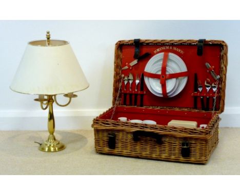 A Fortnum and Mason wicker picnic hamper, 65 by 43 by 22cm high, together with a modern brass effect table lamp with cream sh