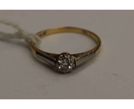 A solitaire diamond ring, claw set with a brilliant cut diamond weighing approx 0.25ct, size O,   18ct yellow gold with plati