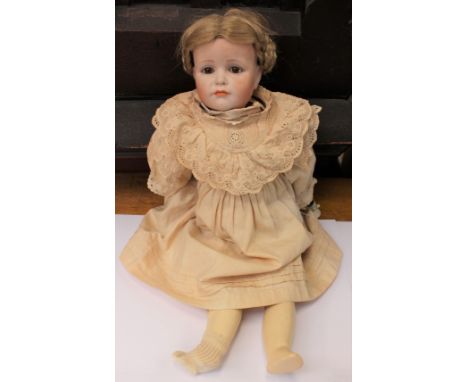 KAMMER REINHARDT: A reproduction bisque head Kammer Reinhardt girl doll, open eyes, closed mouth, to reverse 'K R 114 W', cre