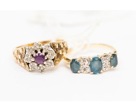 A 9ct gold amethyst and diamond cluster ring,, bark effect shoulders, size N, along with  a blue topaz and diamond ring, size