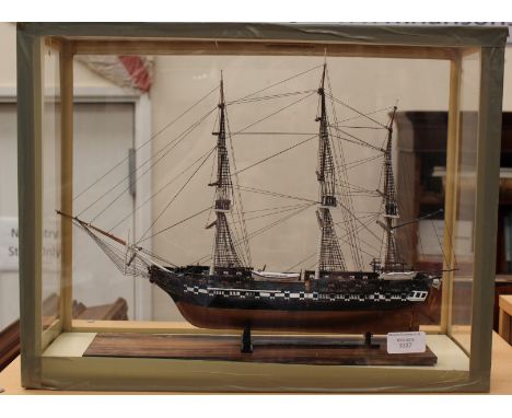A cased model of the USS Constitution, 46cm x 36cm x 19cm approx.