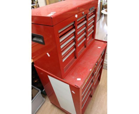 Two Craftsmen tool boxes containing a large quantity of tools and items
