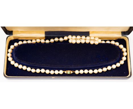 A Mikimoto cultured pearl necklace, having 9ct gold, jade and pearl set clasp, stamped '9' and '375', in original box 