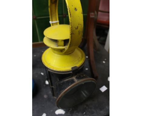 Multi coloured railway guards, hand lamp