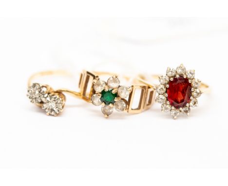 A collection of three 9 ct gold rings, including a diamond two stone ring, and two paste set rings, sizes L ½ and N, with a c
