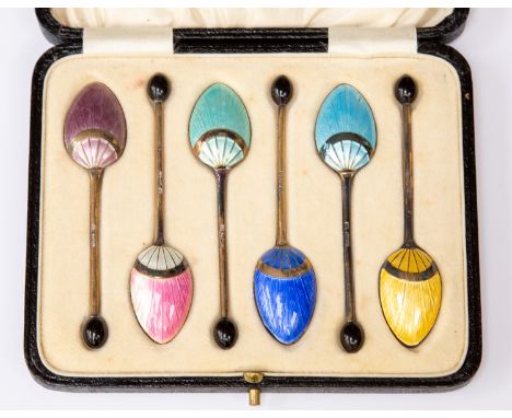 Set of six silver gilt coffee spoons, enamel backs, Birmingham 1929