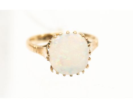 An opal and 9ct gold ring, the cuhion claw set opal displaying green and orange play of colour, approx 9mm x 10mm, size L, to
