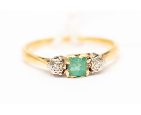 An emerald and diamond set ring, square cut emerald approx 0.15ct, with small illusion set diamonds either side, 18ct gold, s