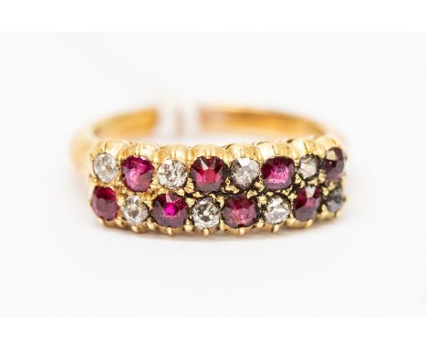 A ruby and diamond ring, double rows set with alternating ruby and diamonds, unmarked yellow metal, possibly 14ct gold, size 