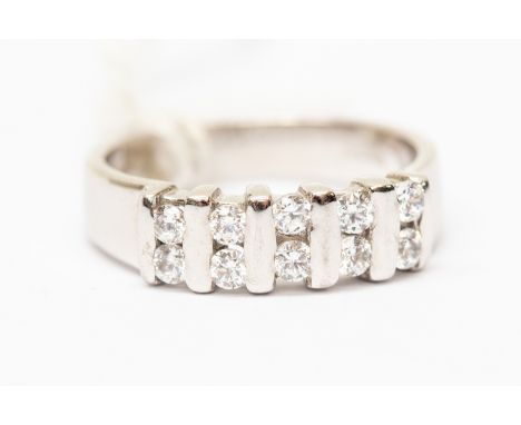 A cubic zirconia and 9ct white gold dress ring, the ring bar set with alternate double round cut cubic zircnia, width approx 