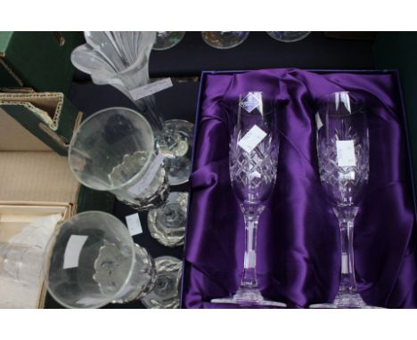 Pair of silver crystal champagne flutes, boxed pair of Edinburgh Crystal champagne flutes and French glass tulip style candle