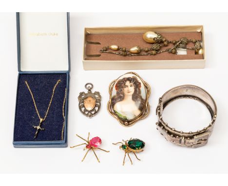 An 1840 silver bangle, Birmingham, a Pinchbeck portrait brooch, on porcelain, two Spider/Beetle brooches, a silver and 9 ct g