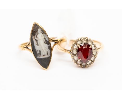 Two 9ct gold dress rings, one set with coloured paste, size L1/2, along with a Wedgwood marquise shaped ring, size O1/2, comb
