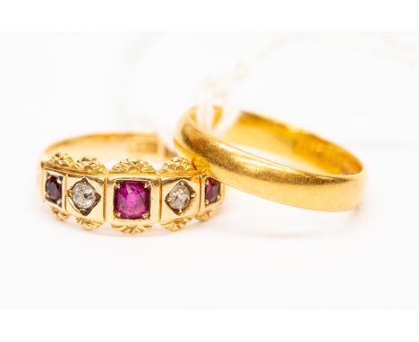 A Victorian ruby and diamond 18ct gold, alternate ruby and diamond ring, with engraved decoration to the border, size Q, tota