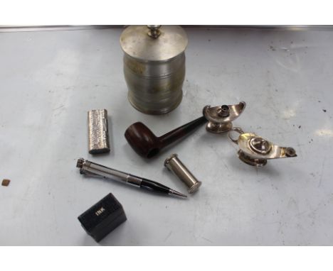 A collection of assorted smoking related items, including two silver table lighters, pipe, tobacco jar, pen lighter etc