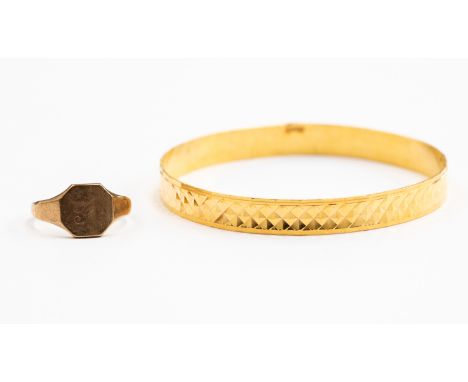 A gold bangle, diamond cut texture, Middle Eastern 24ct gold, internal diameter approx 65mm, weight approx 20.3gms, together 