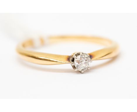A diamond solitaire ring, 18ct gold knife edge shoulders, the old cut diamond claw set, weighing 0.10ct, size N, total gross 
